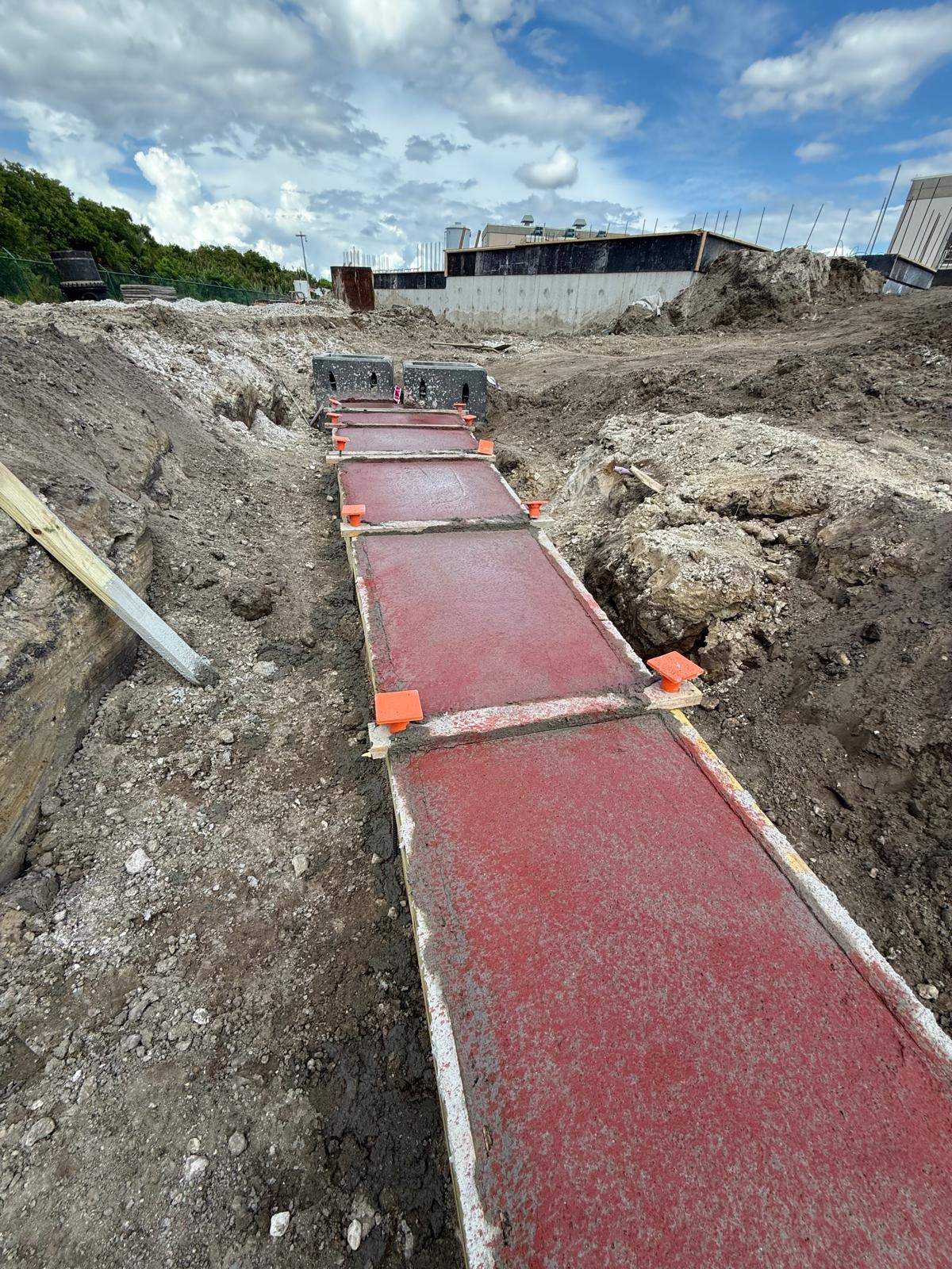 Concrete being placed around a prepared underground conduit bank