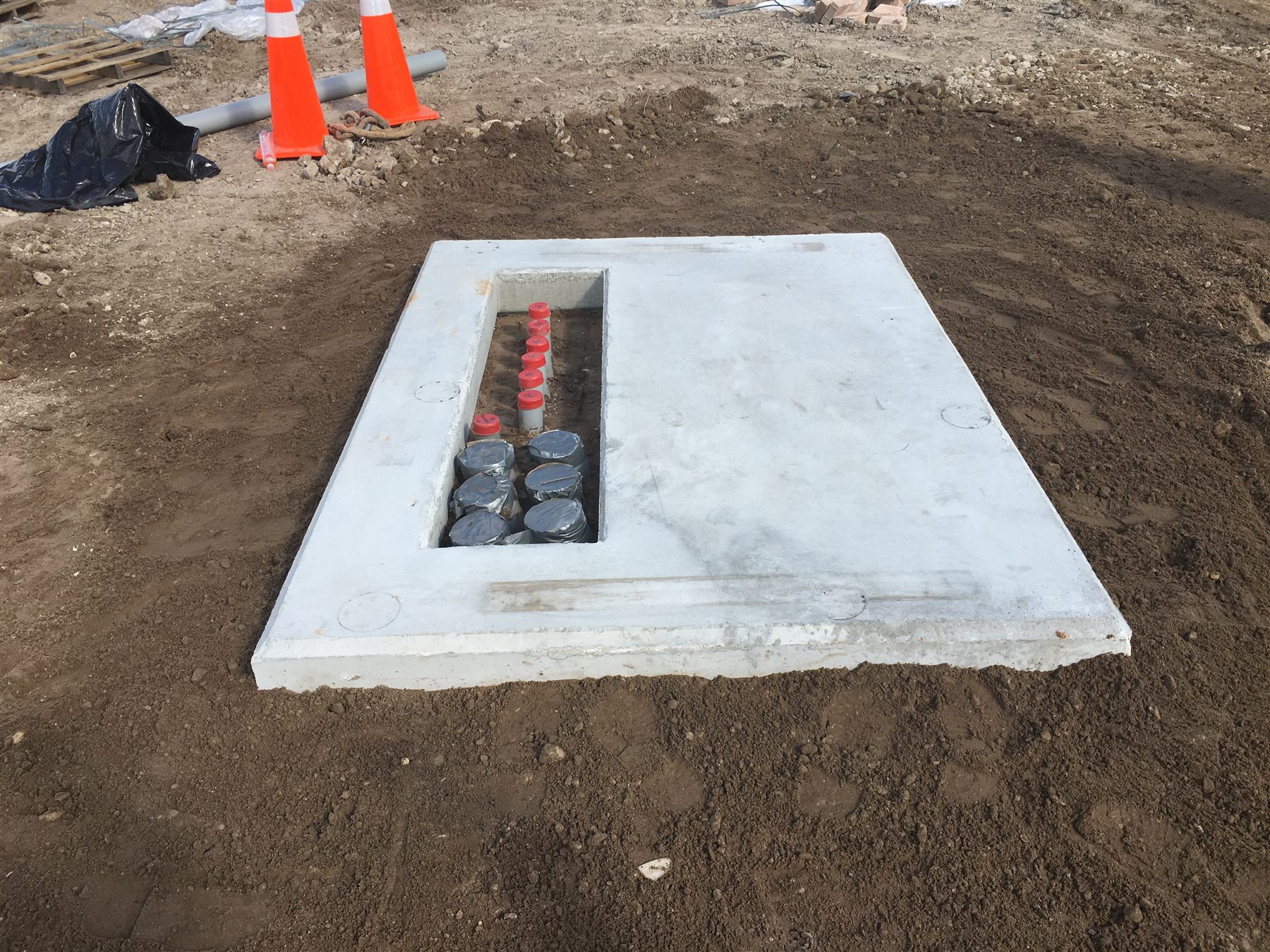 Conduit entries organized inside an underground utility handhole